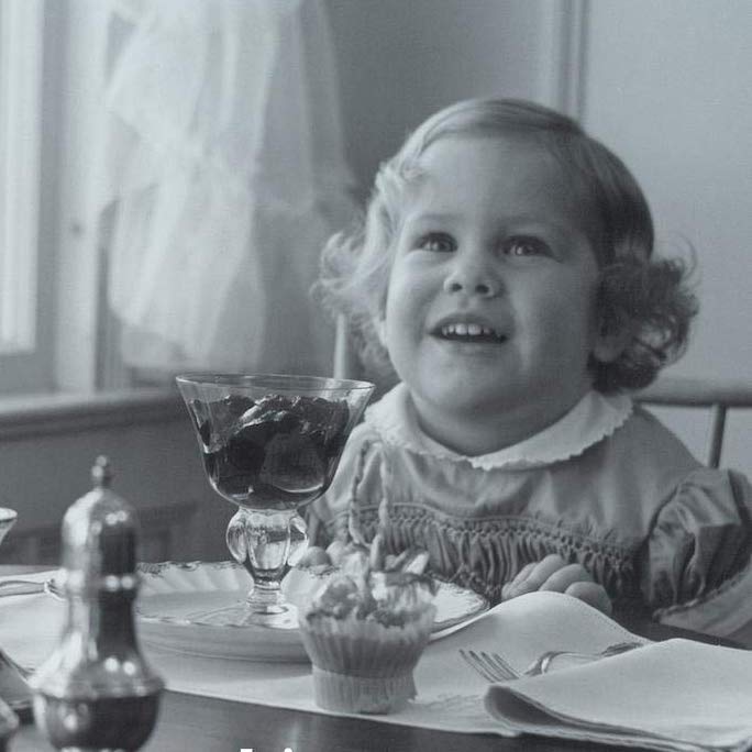 photo of Debby as a baby with a dessert in a stem glass