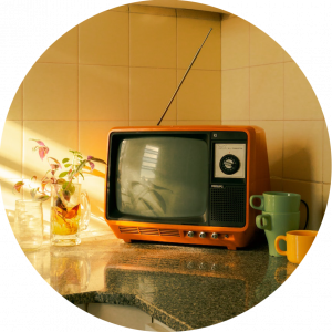 small orange vintage TV on kitchen counter